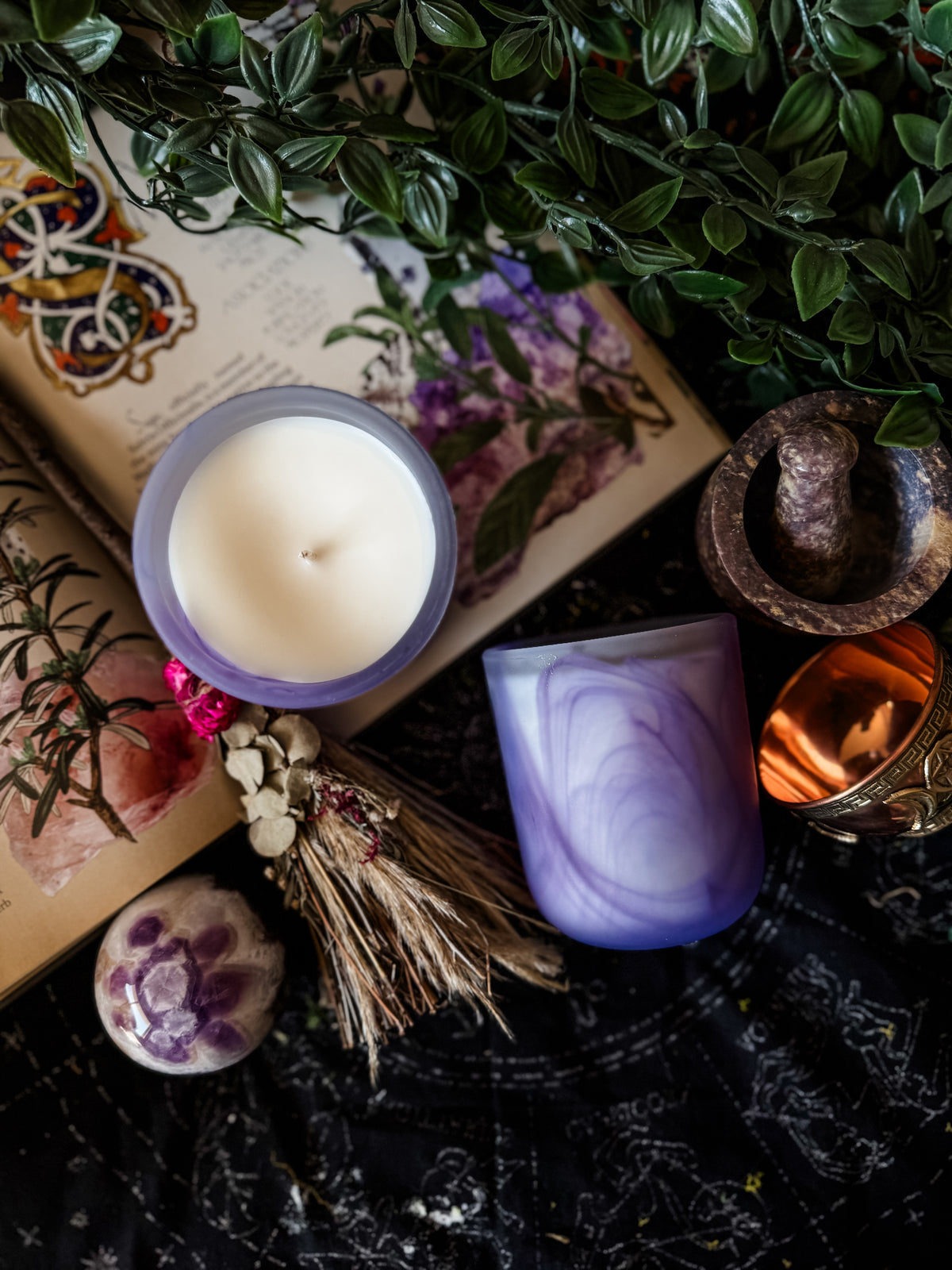 Bound in Wax candle collection photographed in a dark setting